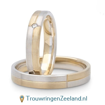 Trouwringen in argentium mat en 14 karaat geelgoud mat in een mooie symmetrie met in de damesring een diamant 