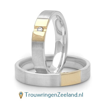 Trouwringen in argentium mat en 14 karaat geelgoud glans gepolijst met in de damesring een diamant in het midden van een dwarsvoeg