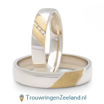 Trouwringen in argentium glans gepolijst en 14 karaat geelgoud mat met in de damesring 3 diamanten schuin gezet