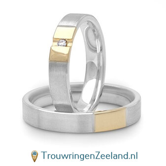 Trouwringen in argentium  en 14 karaat geelgoud glans gepolijst met in de damesring 1 diamant geklemd
