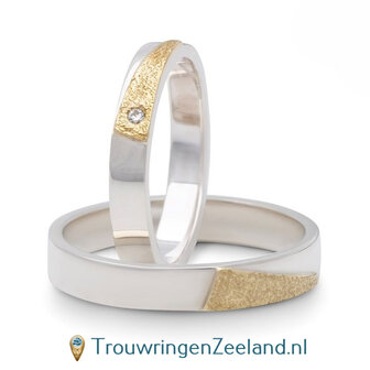 Trouwringen in argentium glans gepolijst en 14 karaat geelgoud ijsmat met in de damesring 1 diamant 