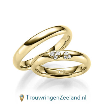 Trouwringen in 14/18 karaat ros&eacute;goud glans gepolijst met in de damesring 6 diamanten in 2 hartjes gezet 0,065 ct 