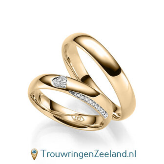 Trouwringen in 14/18 karaat roodgoud glans gepolijst met in de damesring 6 diamanten in een hart en 10 diamanten als randzetting 0,086 ct 