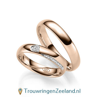 Trouwringen in 14/18 karaat roodgoud glans gepolijst met in de damesring 6 diamanten in een hart en 10 diamanten als randzetting 0,086 ct 