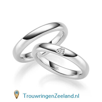 Trouwringen in 8*/14/18 karaat roodgoud glans gepolijst  3,50 mm. breed  en in de damesring 1 diamant in een hart gezet per paar vanaf