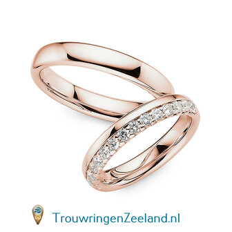 Trouwringen in 14 of 18 karaat witgoud glans gepolijst 4,0 mm. breedte en in de damesring 15 diamanten in een kroon gezet per paar 