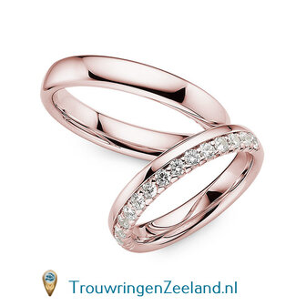 Trouwringen in 14 of 18 karaat witgoud glans gepolijst 4,0 mm. breedte en in de damesring 15 diamanten in een kroon gezet per paar 