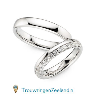 Trouwringen in 14 of 18 karaat witgoud glans gepolijst 4,0 mm. breedte en in de damesring 15 diamanten in een kroon gezet per paar 