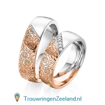 Trouwringen in 14 of 18 karaat witgoud halve ring met met bloemmotief en halve ring glad gepolijst 6,0 mm. breedte met in de damesring 6 diamanten schuin gezet per paar 