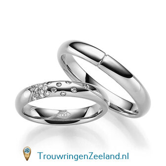 Trouwringen in 14 of 18 karaat witgoud glans gepolijst 4,0 mm. breedte met in de damesring 18 diamanten creatief gezet per paar 