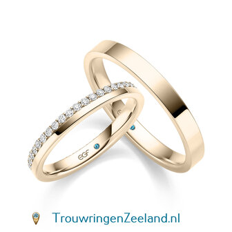 Trouwringen in 14 karaat geelgoud glans gepolijst en in de damesring 42 diamanten geheel rondom in een kroon gezet per paar