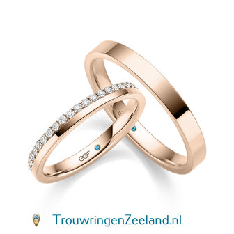 Trouwringen in 14 karaat geelgoud glans gepolijst en in de damesring 42 diamanten geheel rondom in een kroon gezet per paar