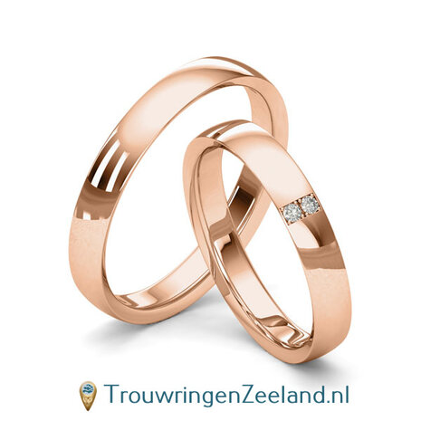 Trouwringen in 8*/14/18 karaat geelgoud glans gepolijst 3,5 mm. breed met in de damesring 2 x 0.015 ct diamanten overdwars gezet