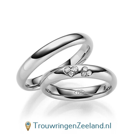 Trouwringen in 14/18 karaat roségoud glans gepolijst met in de damesring 6 diamanten in 2 hartjes gezet 0,065 ct 