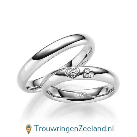 Trouwringen in 14/18 karaat roodgoud glans gepolijst met in de damesring 6 diamanten in 2 hartjes gezet 0,065 ct 