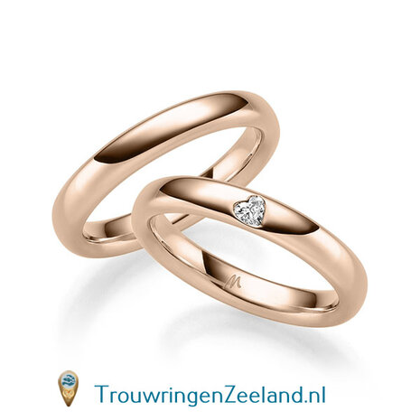Trouwringen in 8*/14/18 karaat witgoud glans gepolijst  3,50 mm. breed  en in de damesring 1 diamant in een hart gezet per paar vanaf