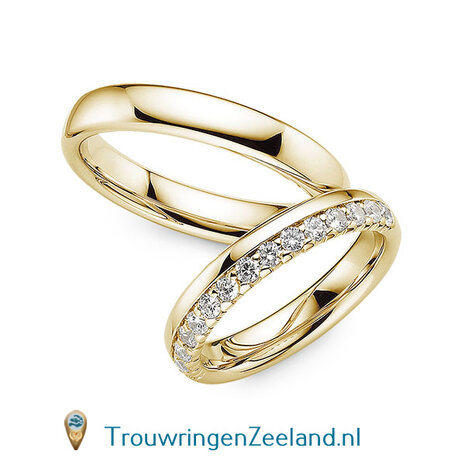 Trouwringen in 14 of 18 karaat witgoud glans gepolijst 4,0 mm. breedte en in de damesring 15 diamanten in een kroon gezet per paar 