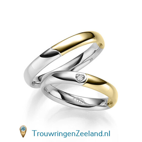 Trouwringen in 14 of 18 karaat witgoud glad gepolijst 4,0 mm. breedte met in de damesring 1 diamant in een hart gezet per paar 