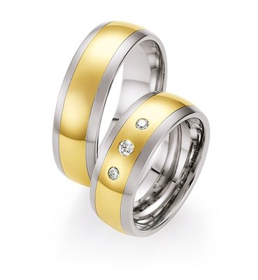 Trouwringen in edelstaal en geelgoud met diamant(en) per paar