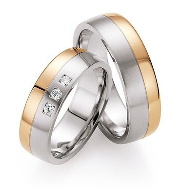 Trouwringen in edelstaal en roodgoud met diamant(en) per paar