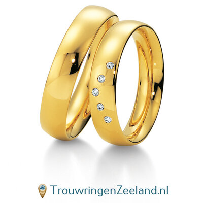 Trouwringen in 8*/14/18 karaat geelgoud glans met in de damesring 5 diamanten in een V vorm per paar
