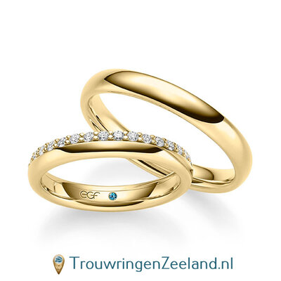Trouwringen in 14/18 karaat geelgoud glans met een kroonzetting van 17 diamanten - halve ring - in de damesring
