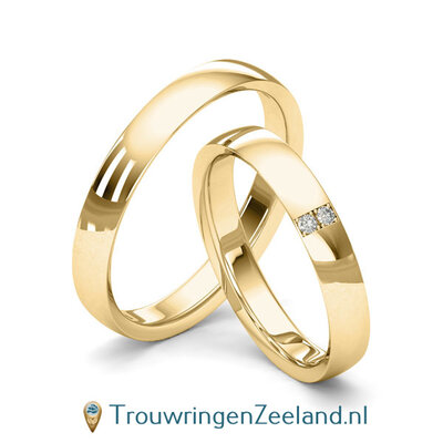 Trouwringen in 8*/14/18 karaat geelgoud glans gepolijst 3,5 mm. breed met in de damesring 2 x 0.015 ct diamanten overdwars gezet