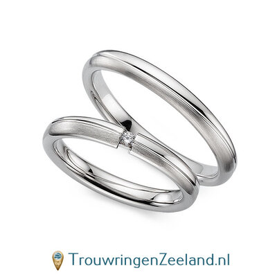 Trouwringen in 8*/14/18 karaat witgoud mat en glans 3,0 mm. breed met 2 golven en in de damesring  1 diamant 0,03 ct