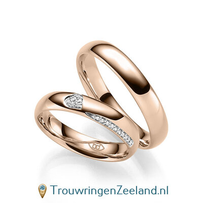 Trouwringen in 14/18 karaat roodgoud glans gepolijst met in de damesring 6 diamanten in een hart en 10 diamanten als randzetting 0,086 ct