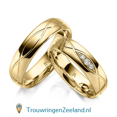 Trouwringen in 8, 14 of 18 karaat geelgoud glans gepolijst 5,5 mm. breedte en in de damesring 3 diamanten in een ovaal gezet per paar