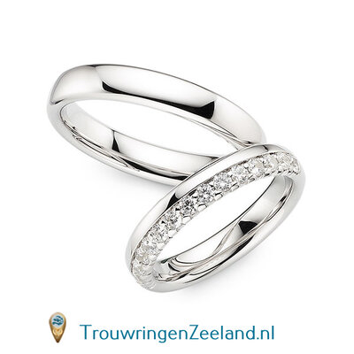 Trouwringen in 14 of 18 karaat witgoud glans gepolijst 4,0 mm. breedte en in de damesring 15 diamanten in een kroon gezet per paar