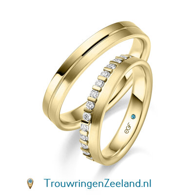 Trouwringen in 14 of 18 karaat geelgoud mat en glans gepolijst met een midden scheidingsvoeg en in de damesring 15 diamanten in een kroon gezet per paar